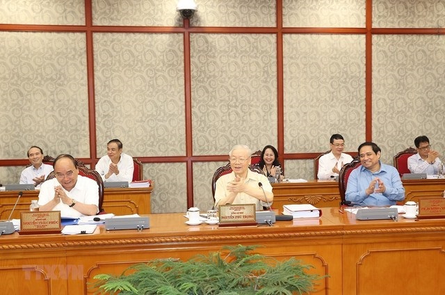 Tổng Bí thư Nguyễn Phú Trọng, Chủ tịch nước Nguyễn Xuân Phúc và Thủ tướng Phạm Minh Chính tại cuộc họp.